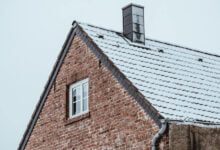 Before and after chimney restoration showing improved home value and curb appeal