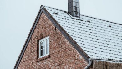 Before and after chimney restoration showing improved home value and curb appeal