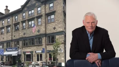 A view of the Kelleher Pocahontas Iowa hotel owner house, showcasing its classic design and beautiful landscaping.