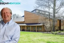 Jim Davis House in Albany, Indiana features natural wood siding, a covered porch, and distinctive architecture nestled among trees where the Garfield creator found inspiration.