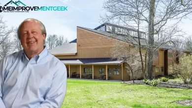 Jim Davis House in Albany, Indiana features natural wood siding, a covered porch, and distinctive architecture nestled among trees where the Garfield creator found inspiration.