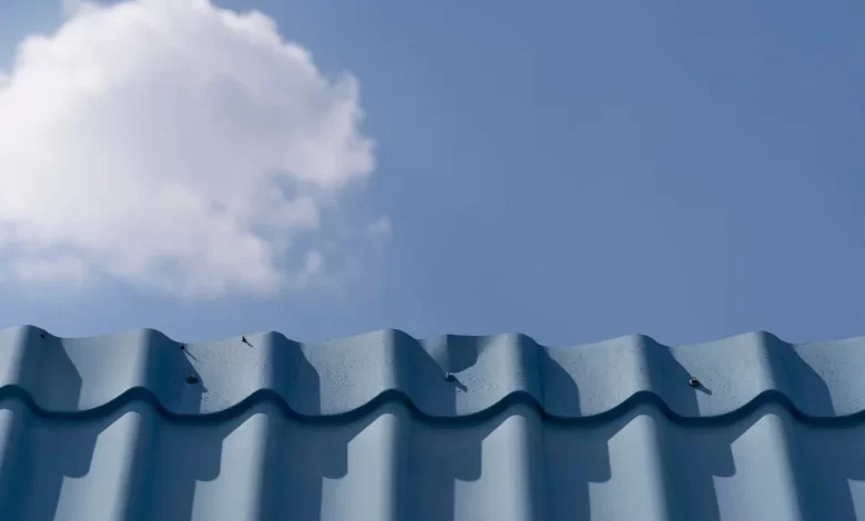 Roofing Services in Atlanta - Roofing | HomeImprovementGeek Professional roofing services in Atlanta showing experts working on a home roof under clear skies