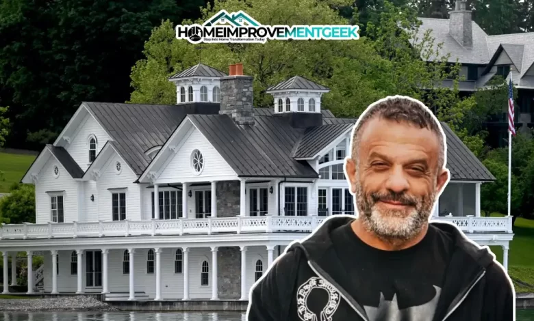Adam Weitsman House: The Billionaire's Stunning Real Estate Collection Worth Millions - Luxury Real Estate | HomeImprovementGeek The image displays the Adam Weitsman House, a stunning white mansion with classic architectural details, including multiple gables, cupolas, and spacious wraparound porches.