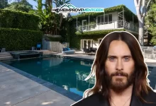 Front view of the Jared Leto House, a striking Hollywood Hills mansion surrounded by lush gardens and modern architectural details.