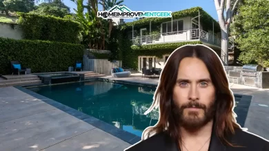 Front view of the Jared Leto House, a striking Hollywood Hills mansion surrounded by lush gardens and modern architectural details.