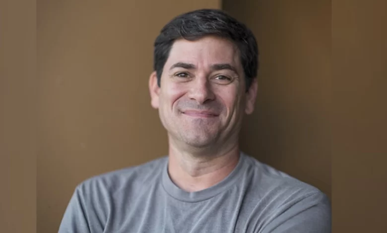 Jim Goldstein House owner James Goldstein smiling in casual grey shirt
