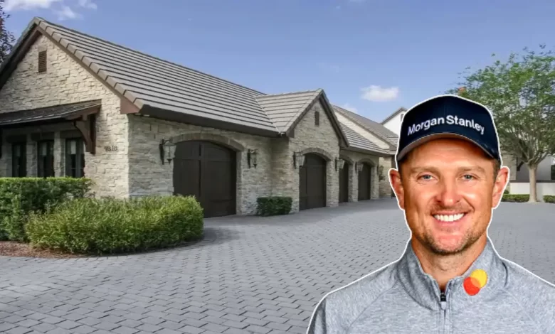 Inside the Justin Rose House: Where Golf Greatness Meets Luxury Living - Luxury Real Estate | HomeImprovementGeek Justin Rose smiling in front of luxury stone house with circular driveway and landscaped grounds