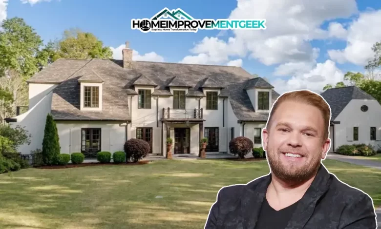 Front view of the luxury Tudor-style Kyle Jacobs House in Nashville, showing elegant design, lush landscaping, and the home’s stately entrance.