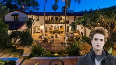 Robert Pattinson house Hollywood Hills Spanish Colonial luxury estate with outdoor patio and palm trees at night