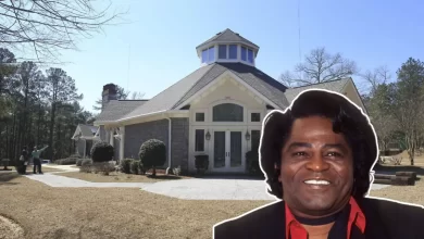 James Brown House exterior view in Beech Island South Carolina showing the main residence and tour buses on front lawn