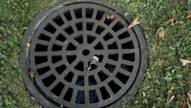 signs of septic system failure with slow drains, odors, and clogs