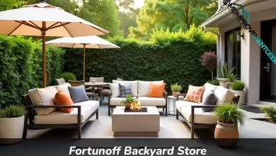 Fortunoff Backyard Store outdoor furniture display showing patio dining set and conversation seating with cushions
