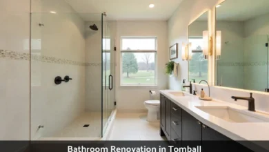 Modern bathroom renovation in Tomball featuring walk-in shower with frameless glass, floating vanity, and contemporary fixtures