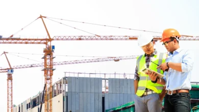 Construction solutions showing modern building site with steel framework, concrete foundation, and skilled workers using quality materials