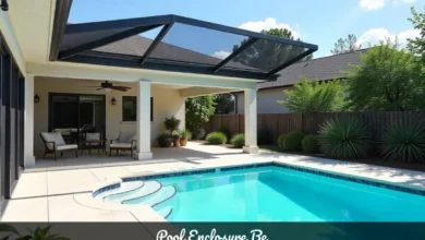 Pool enclosure height showing full screen cage structure from ground to peak with safety barrier around residential swimming pool