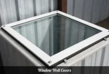 Window well covers installed on basement window protecting home from falls and water damage