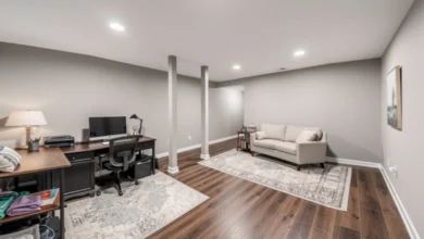 Finished basement ideas showing multi-functional space with home office, lounge area, natural light, neutral walls, and luxury vinyl flooring