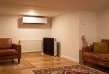 Basement heating methods comparison showing mini-split heat pump and baseboard heaters in finished basement with warm comfortable temperature
