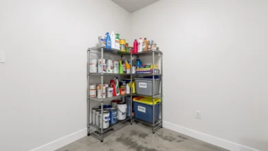 Wire rack basement organization with storage bins and cleaning supplies on concrete floor