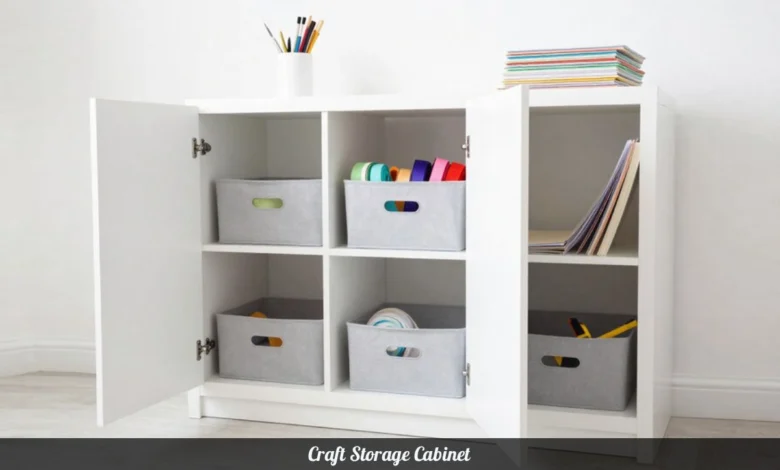 Craft storage cabinet with open doors showing organized drawers and shelves for art supplies and crafting materials