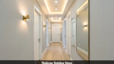 Hallway lighting ideas with recessed lights and brass wall sconces in a modern home corridor