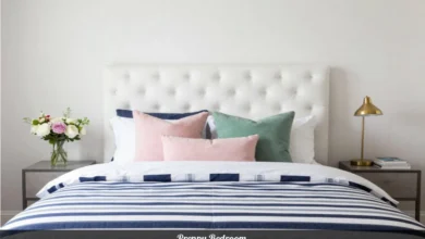 Preppy bedroom with navy striped bedding, white tufted headboard, pink and green throw pillows, brass lamp, and coordinated decor