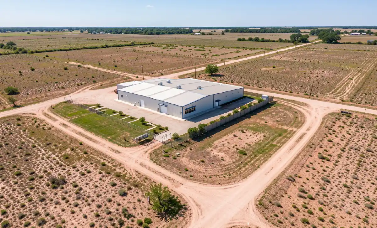 Aerial view of commercial property with land for sale in a rural American setting