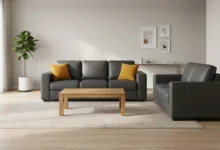 Charcoal leatherette sofa set in a modern living room with wooden coffee table and throw cushions