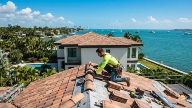 Roofer installing tile roof for roofing services in Miami FL under sunny sky